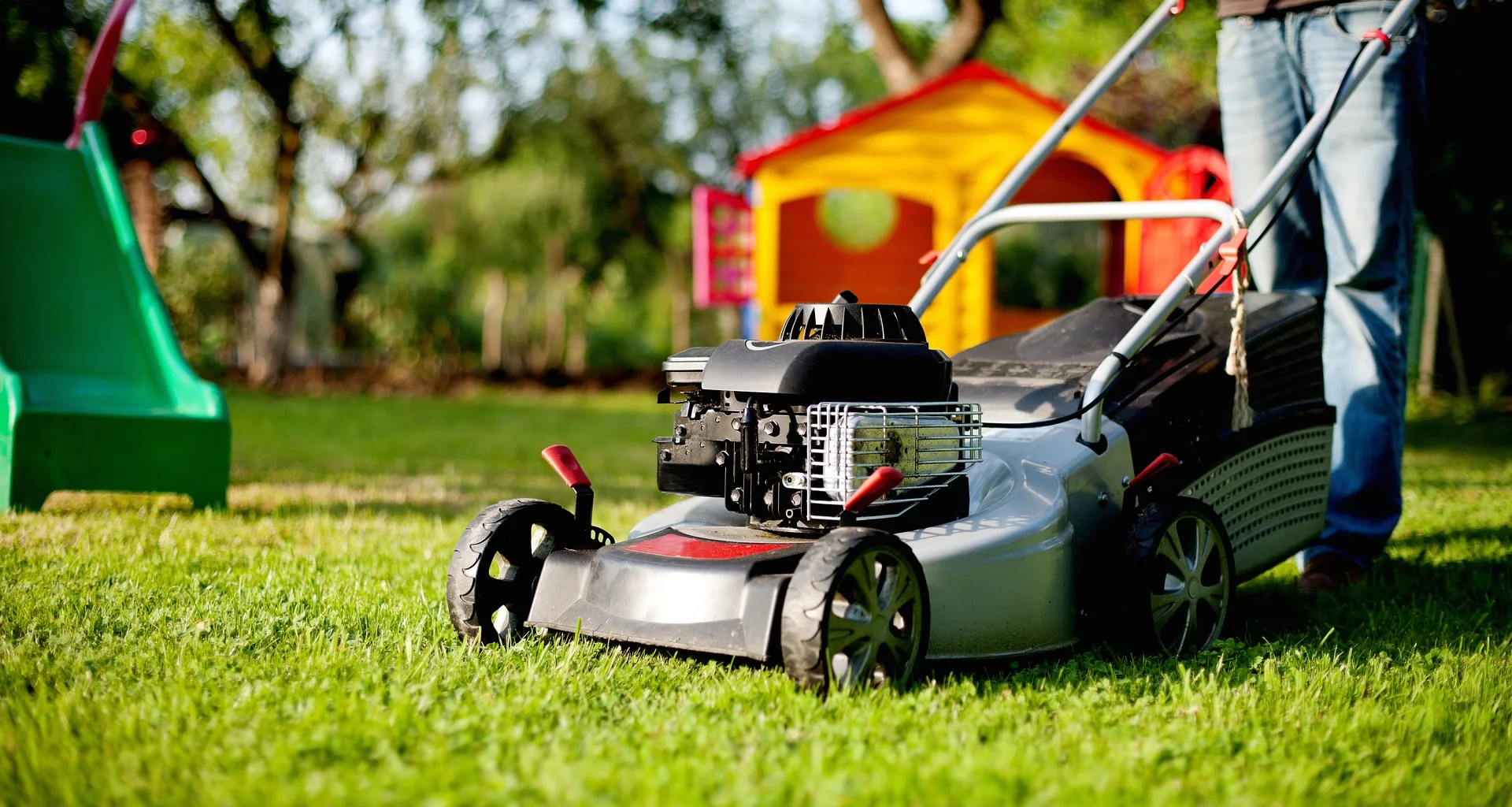 Operator mowing a customer's lawn on a maintenance route